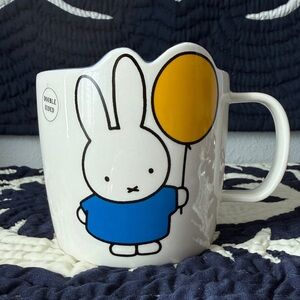 Miffy holding a yellow balloon coffee mug